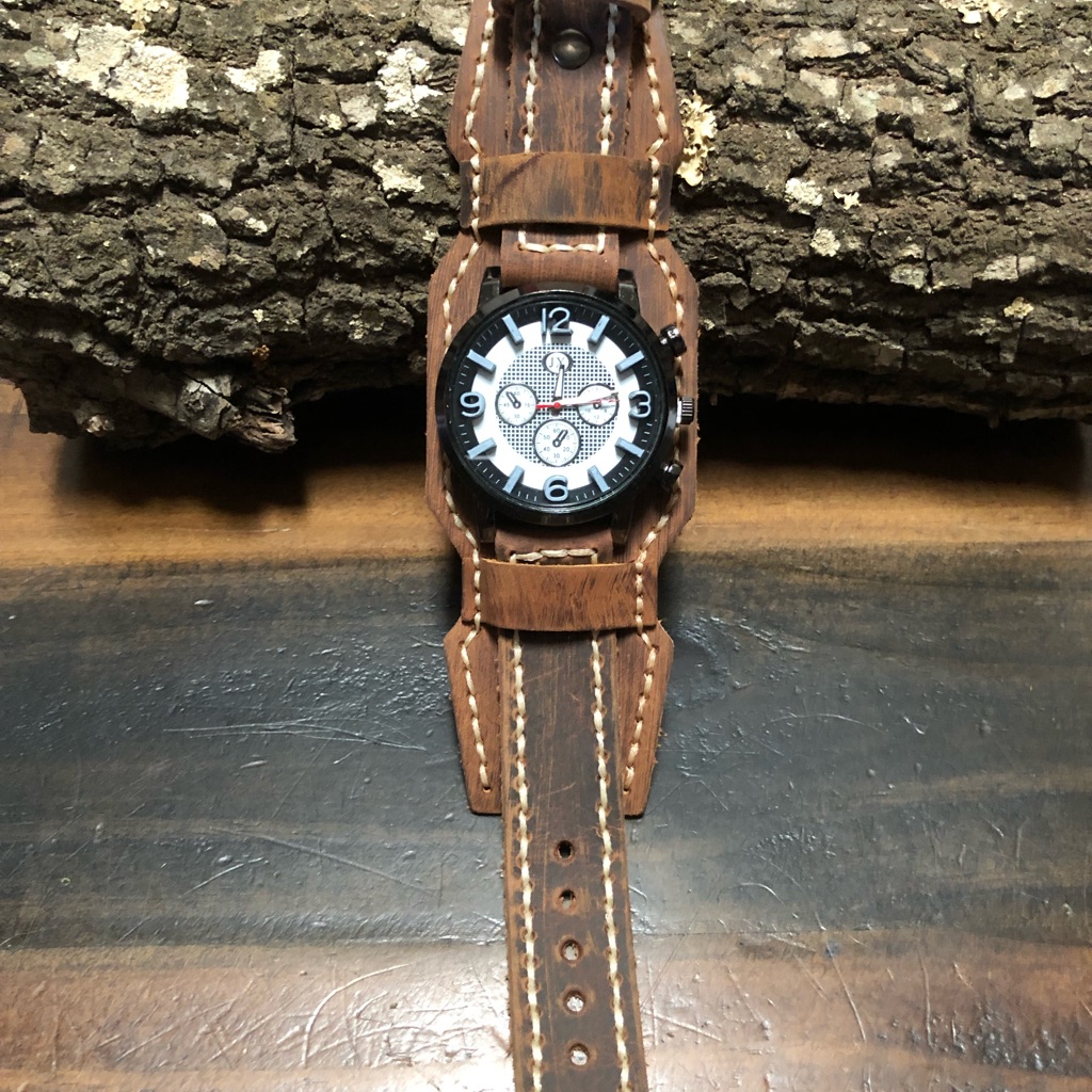 Vintage-style men's watch on a brown strap, photographed for a marketplace listing